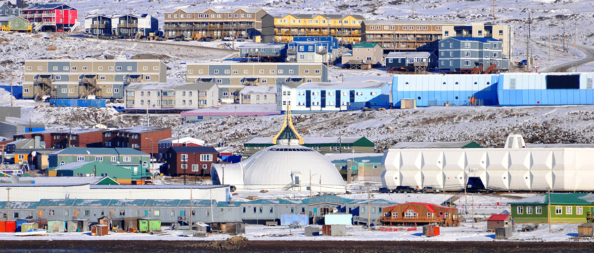 Village of colourful houses in the winter.
