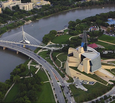 Overhead view of pedestrian bridge beside roadway bridge.